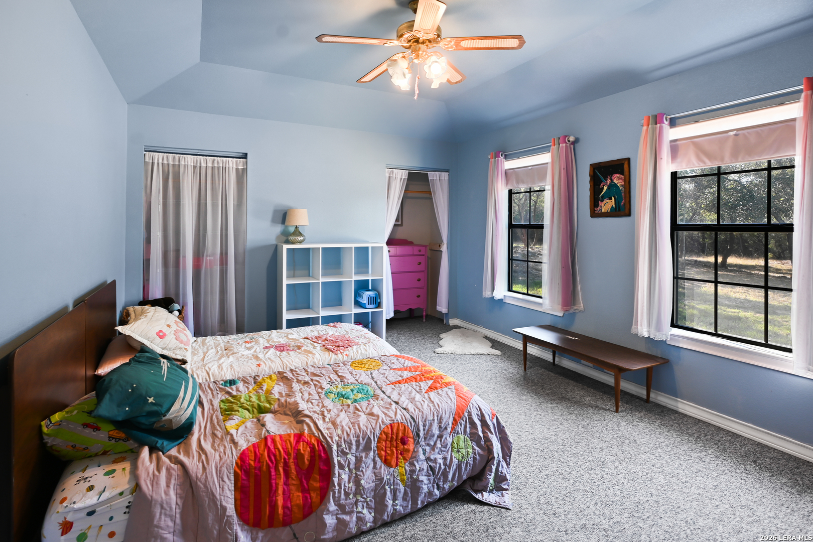 713 Lake Forest Road Pipe Creek, TX 78063 - Photo 10 of 65 a bedroom with bed and window