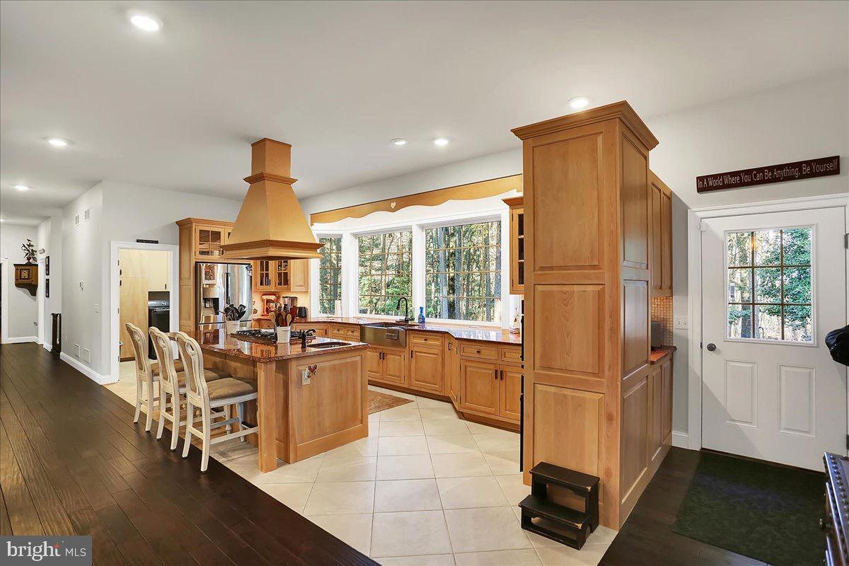338 Candy Road Mohnton, PA 19540 - Photo 17 of 63 Warm wood tones in a sunlit kitchen.