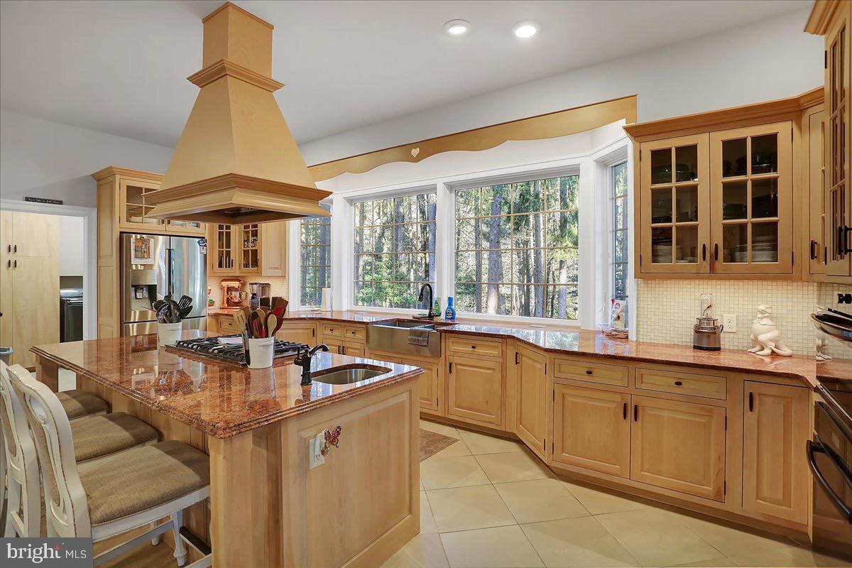 338 Candy Road Mohnton, PA 19540 - Photo 19 of 63 Sunlit kitchen with elegant wood cabinetry.