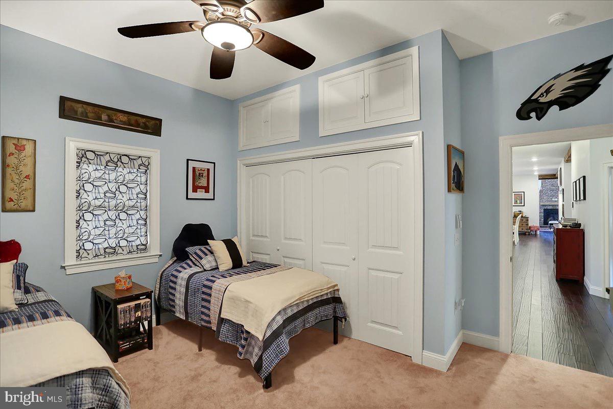 338 Candy Road Mohnton, PA 19540 - Photo 36 of 63 a bedroom with a bed and a chandelier