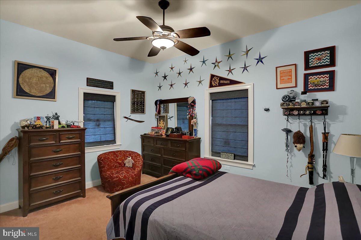 338 Candy Road Mohnton, PA 19540 - Photo 37 of 63 a bedroom with furniture and a chandelier