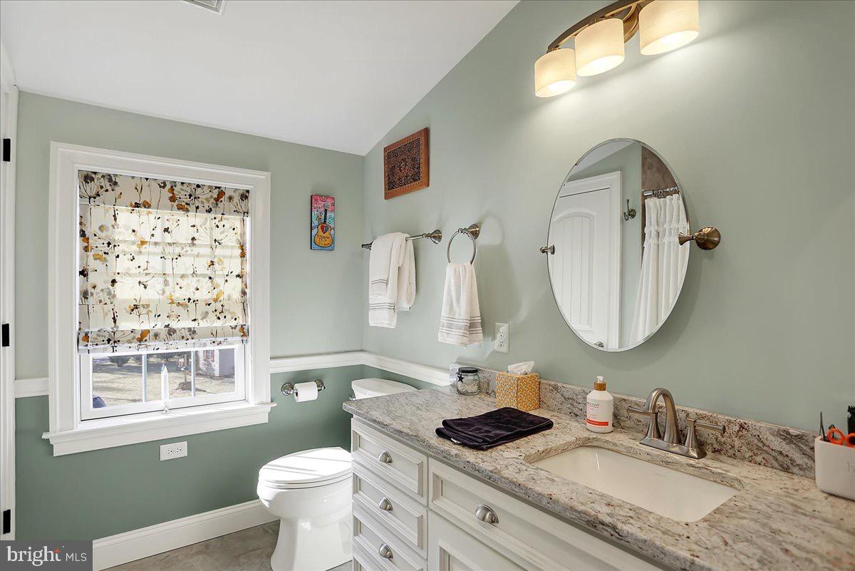 338 Candy Road Mohnton, PA 19540 - Photo 44 of 63 a bathroom with a granite countertop toilet sink and mirror