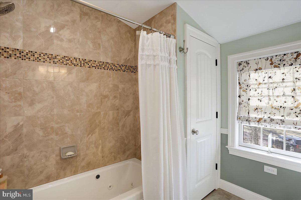 338 Candy Road Mohnton, PA 19540 - Photo 45 of 63 a bathroom with a shower and a window