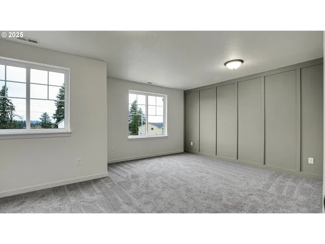 a living room with a window and a projector