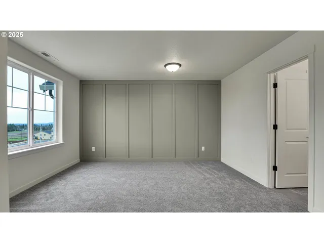 a bathroom with a sink double vanity granite tub shower and a mirror