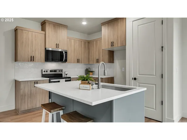 a kitchen with a table and chairs