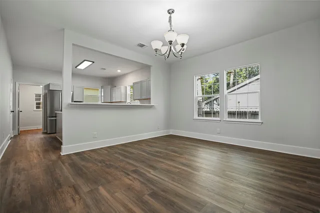 a kitchen that has a sink and a stove