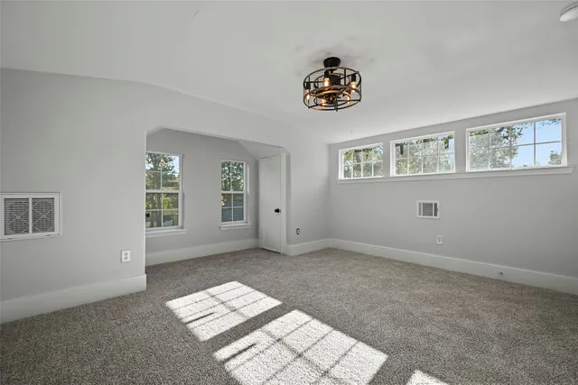 a view of an empty room and window