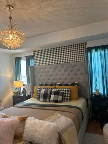 a bedroom with bed and window