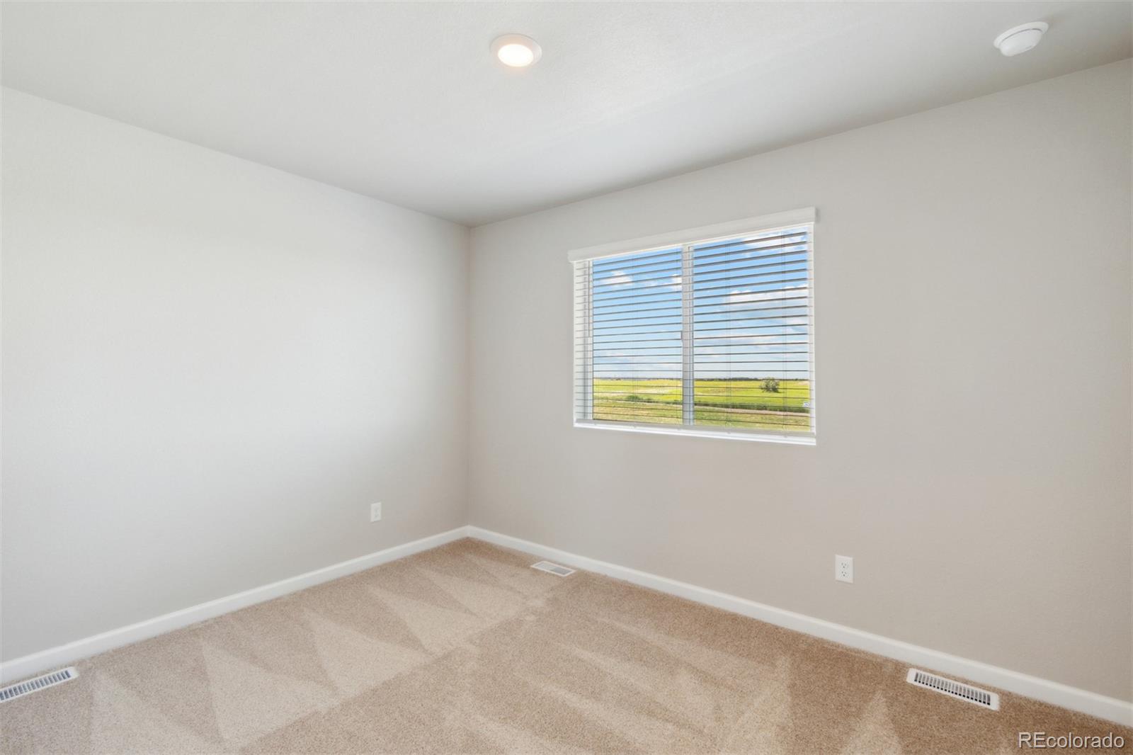 7402 Crystal Avenue Frederick, CO 80530 - Photo 13 of 26 a view of an empty room with a window
