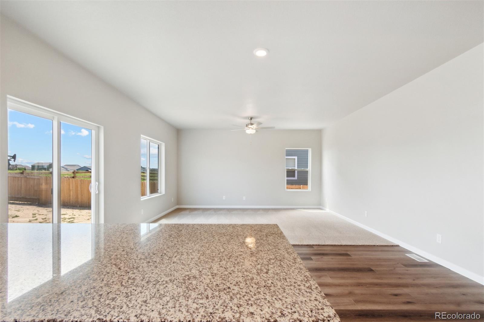 7402 Crystal Avenue Frederick, CO 80530 - Photo 6 of 26 a view of an empty room with glass door