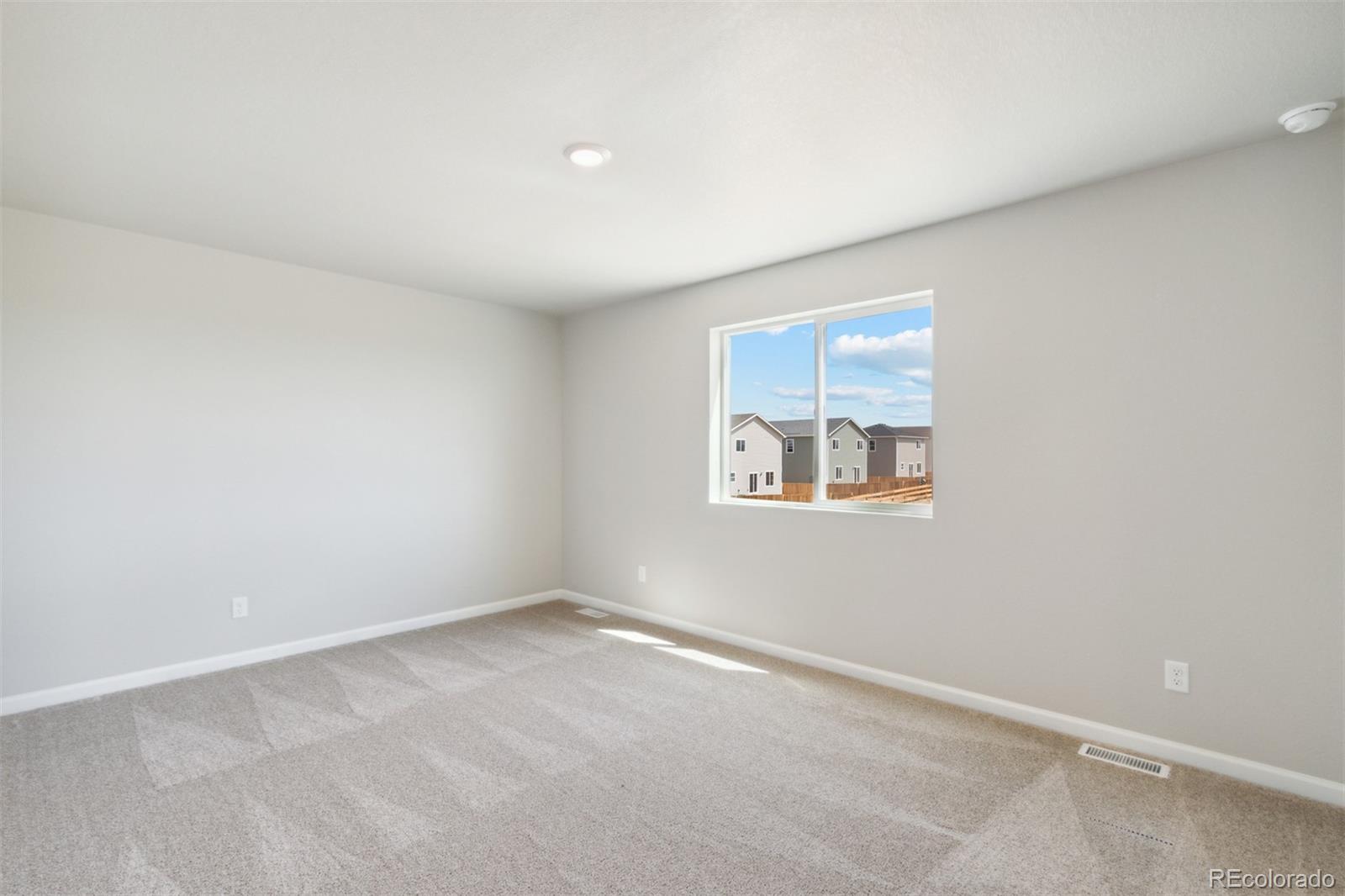 7402 Crystal Avenue Frederick, CO 80530 - Photo 8 of 26 an empty room with a window