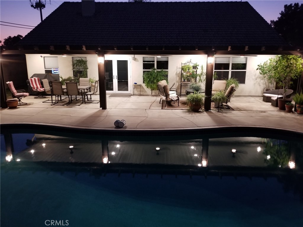 1806 Madison Street Redlands, CA 92374 - Photo 14 of 31 a view of a patio with table and chairs and potted plants