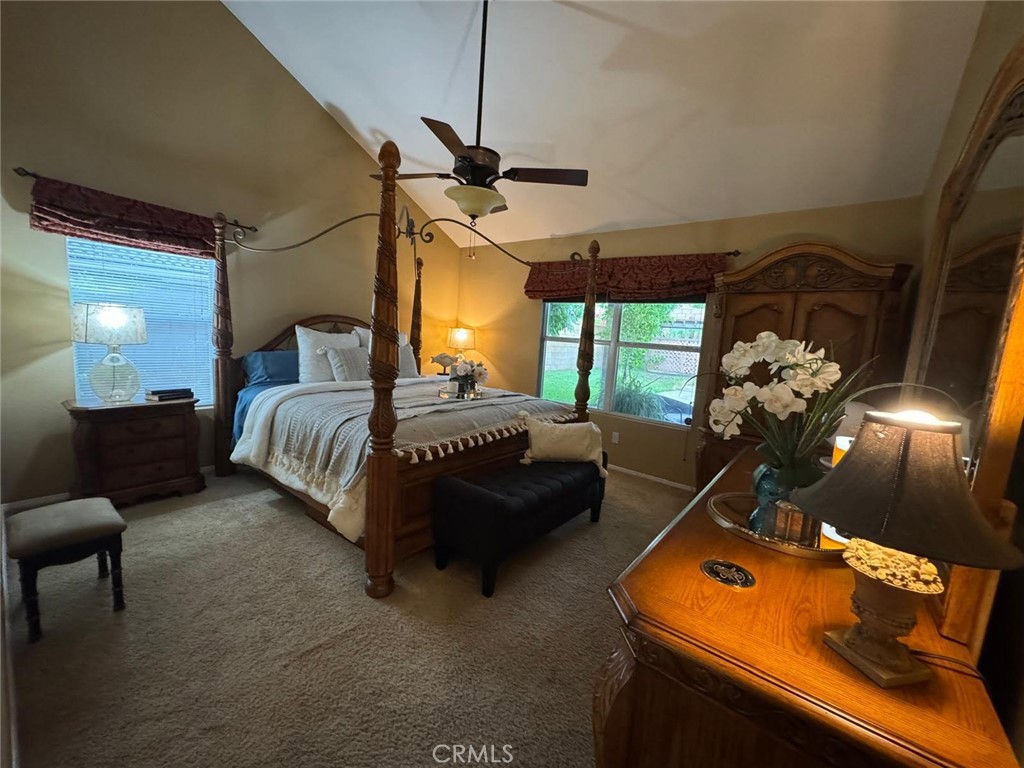 1806 Madison Street Redlands, CA 92374 - Photo 24 of 31 a bedroom with bed window and couch