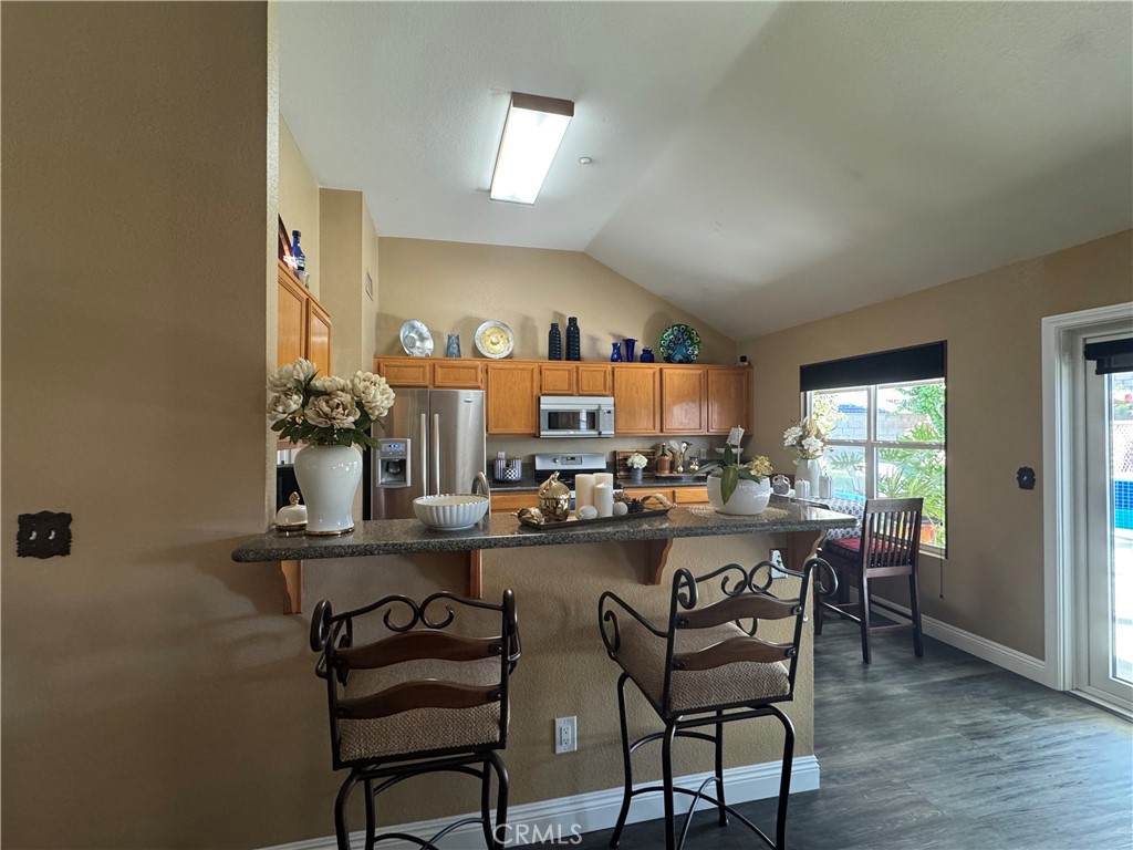 1806 Madison Street Redlands, CA 92374 - Photo 27 of 31 a view of a dining room with furniture and a window