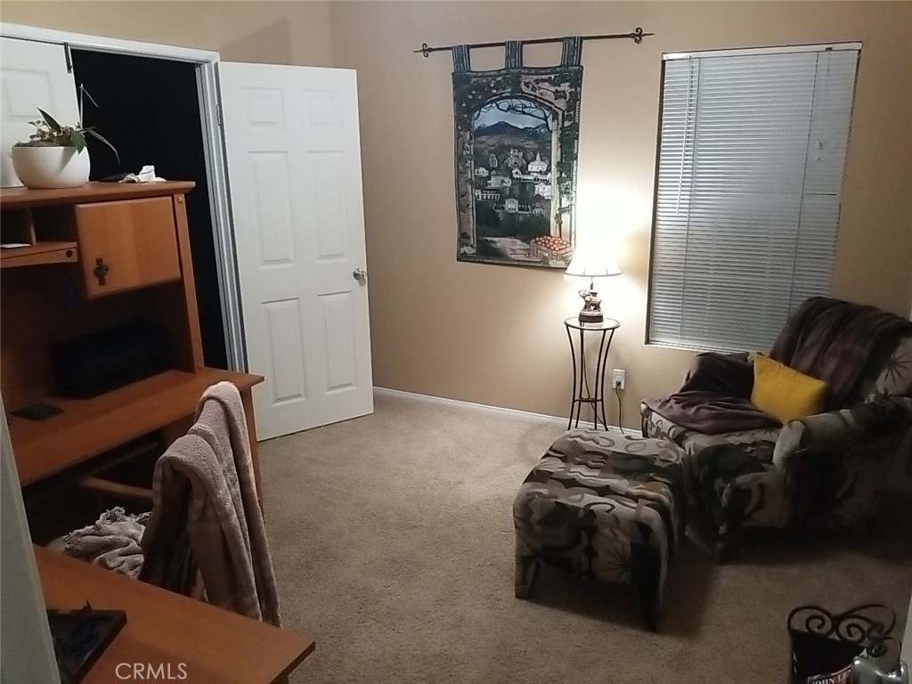 1806 Madison Street Redlands, CA 92374 - Photo 5 of 31 a bed room with a bed and a television