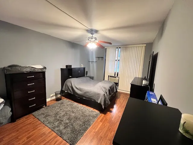 a bedroom with a bed and a dresser