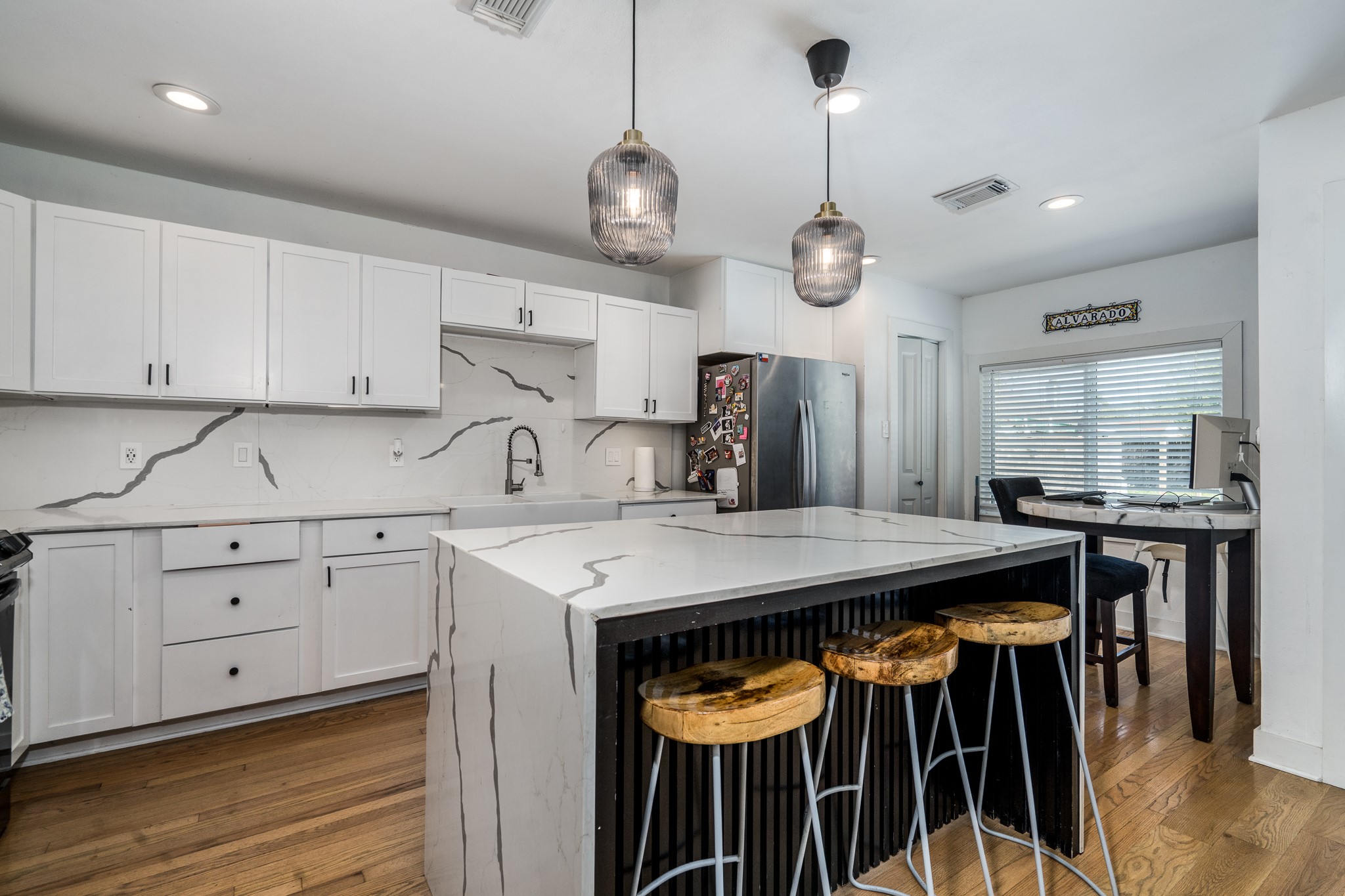 810 Jerry Street Houston, TX 77022 - Photo 5 of 20 Modern kitchen with waterfall quartz and plenty of cabinets