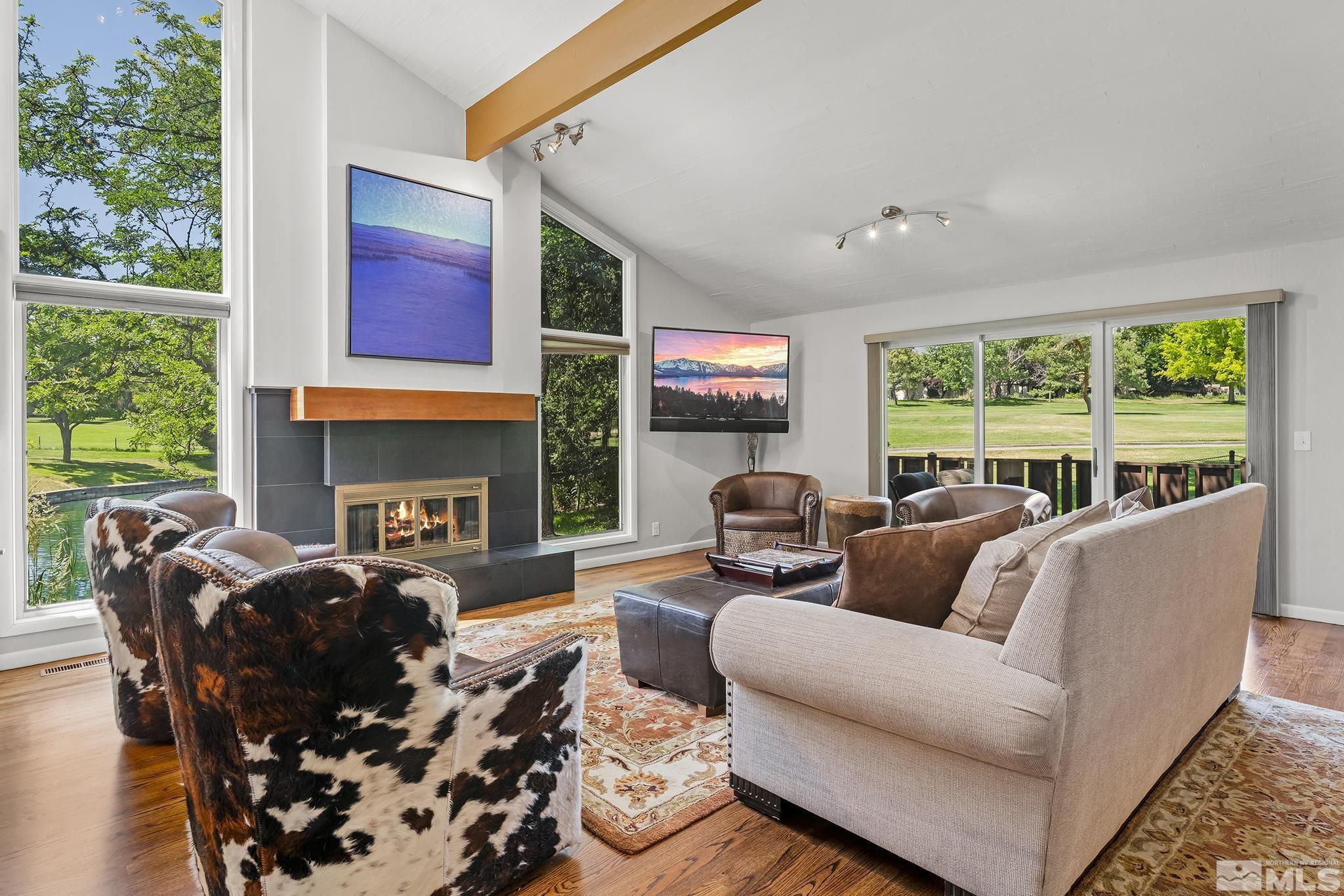 1953 South Villa Way Reno, NV 89509 - Photo 1 of 31 a living room with furniture fireplace and a large window