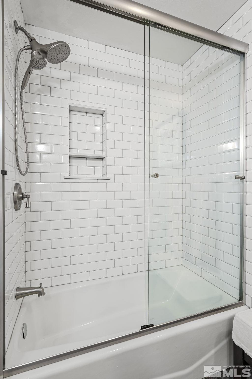 1953 South Villa Way Reno, NV 89509 - Photo 21 of 31 a bathroom with a shower and a bathtub