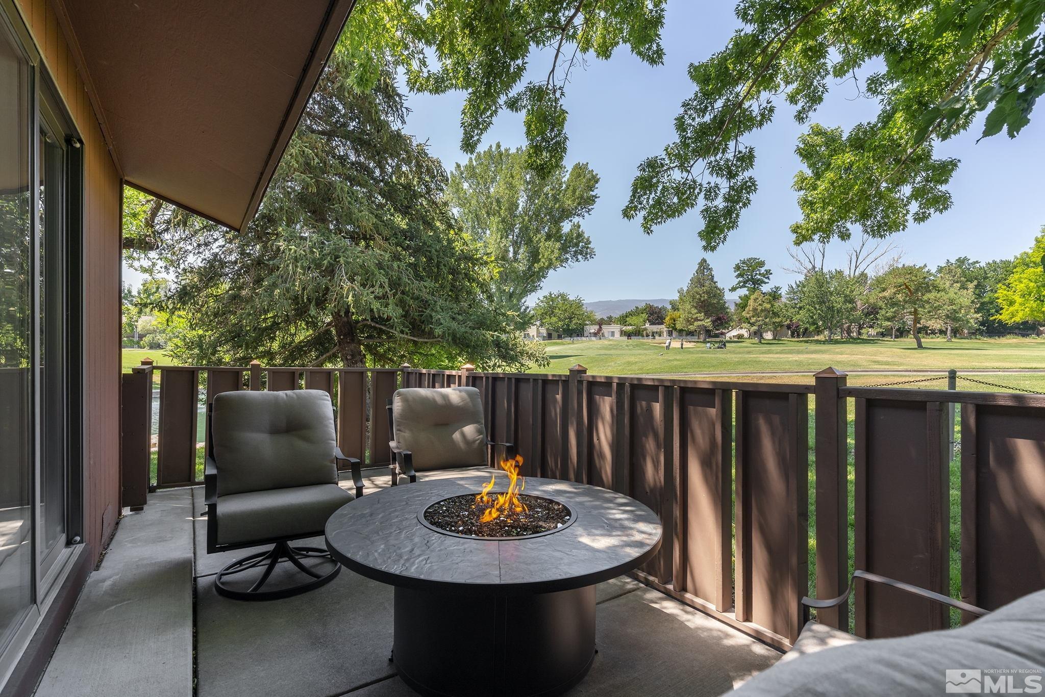 1953 South Villa Way Reno, NV 89509 - Photo 25 of 31 a backyard of a house with fire pit and outdoor seating