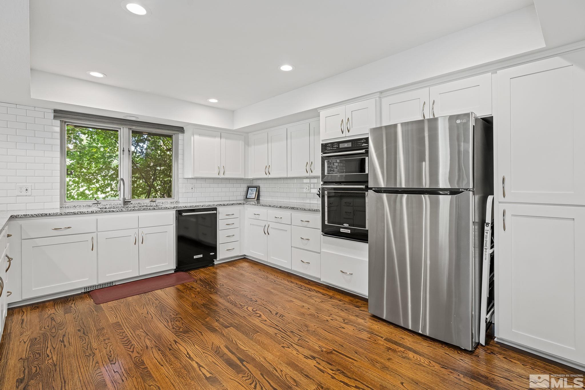 1953 South Villa Way Reno, NV 89509 - Photo 10 of 31 a kitchen with a refrigerator and a stove top oven