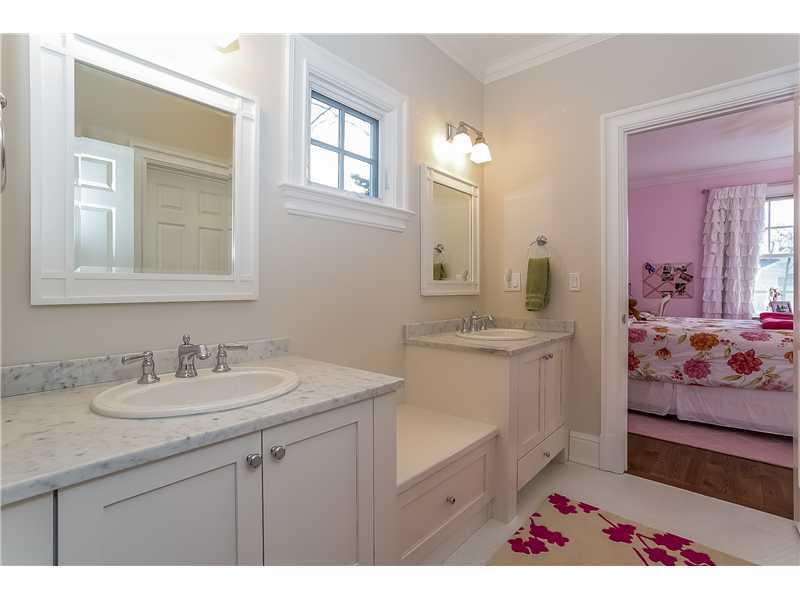 101 Raymond Street Darien, CT 06820 - Photo 17 of 25 a bathroom with double vanity sink two mirror and window
