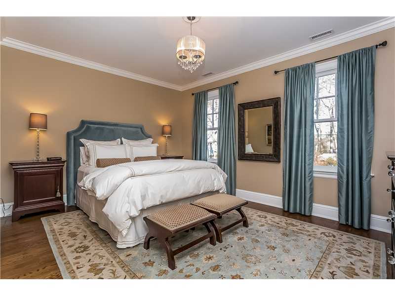 101 Raymond Street Darien, CT 06820 - Photo 19 of 25 a bed sitting in a bedroom next to a window