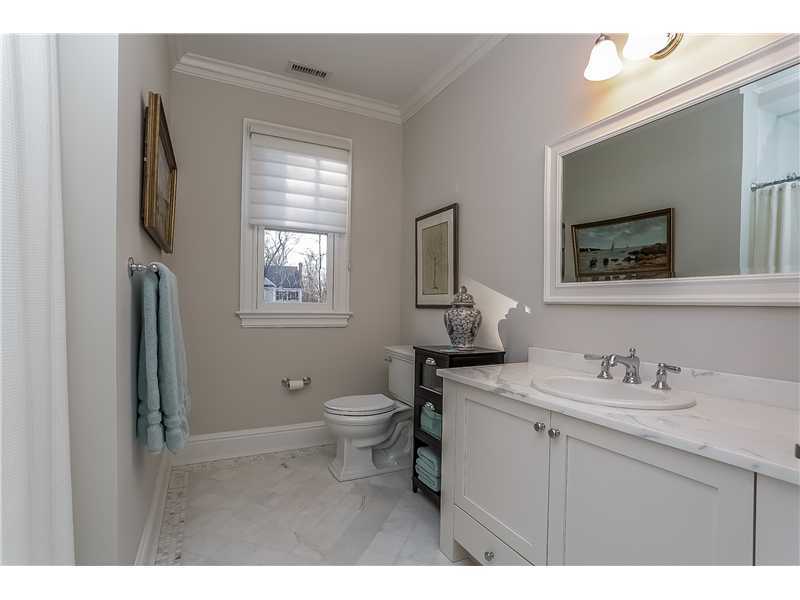 101 Raymond Street Darien, CT 06820 - Photo 20 of 25 a bathroom with a toilet sink and mirror