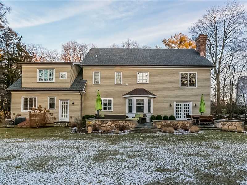 101 Raymond Street Darien, CT 06820 - Photo 22 of 25 a front view of a house with a yard