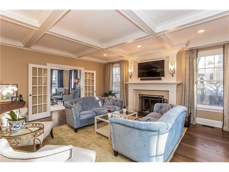 101 Raymond Street Darien, CT 06820 - Photo 5 of 25 a living room with furniture a fireplace and a flat screen tv