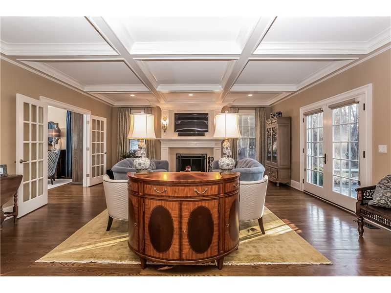 101 Raymond Street Darien, CT 06820 - Photo 6 of 25 a living room with furniture a flat screen tv and a fireplace