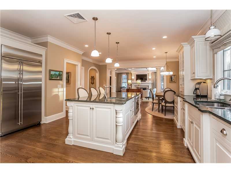 101 Raymond Street Darien, CT 06820 - Photo 8 of 25 a large kitchen with stainless steel appliances kitchen island granite countertop a large counter top and sink