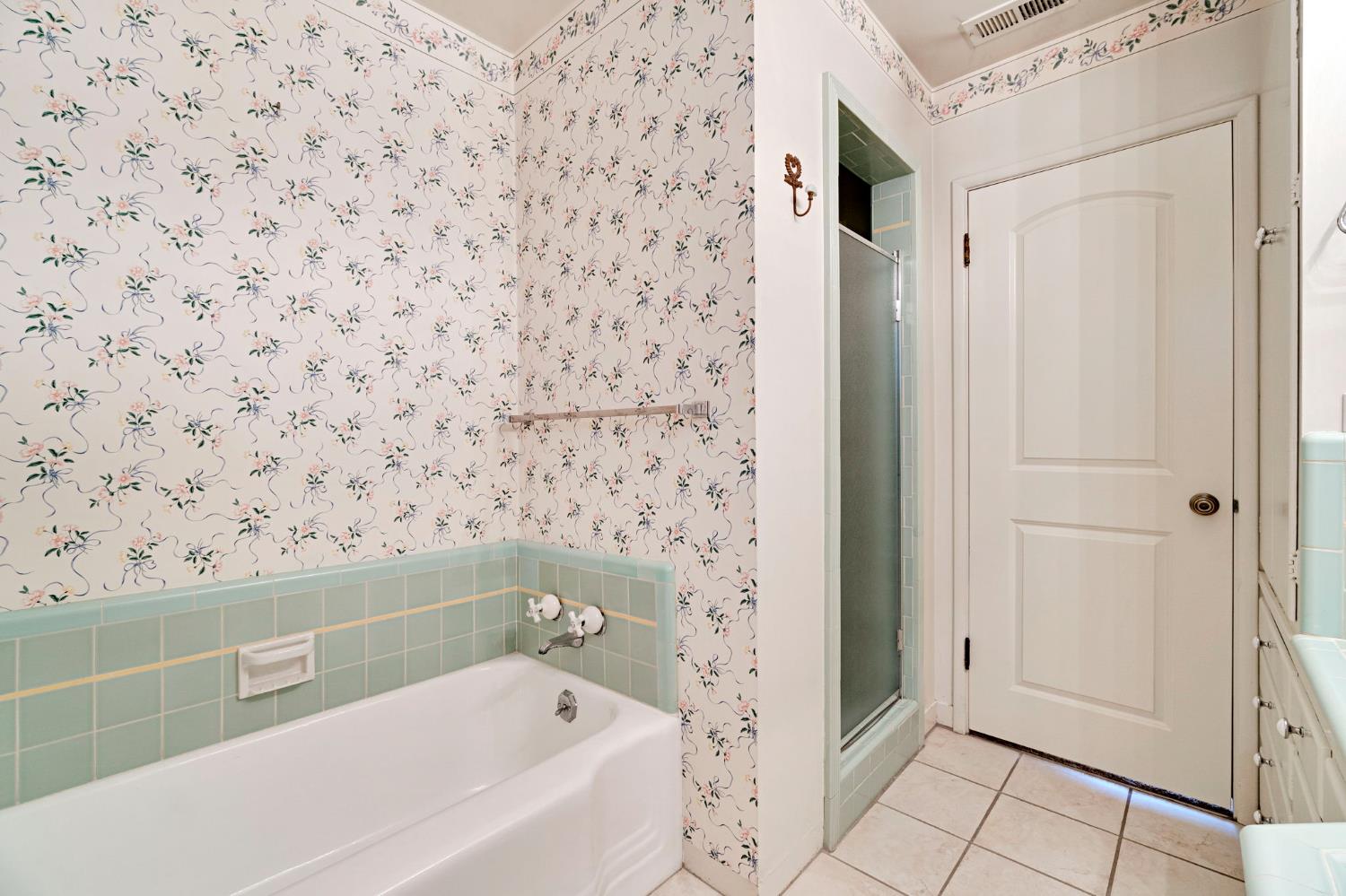 2020 Short Drive Hanford, CA 93230 - Photo 22 of 38 a bathroom with a bathtub and shower