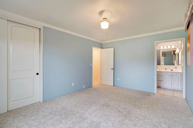 a view of an empty room with a bathroom