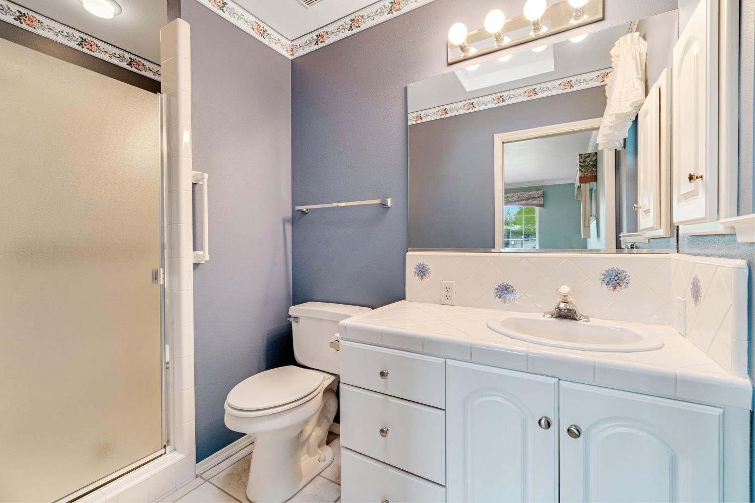 2020 Short Drive Hanford, CA 93230 - Photo 25 of 38 a bathroom with a toilet sink and mirror