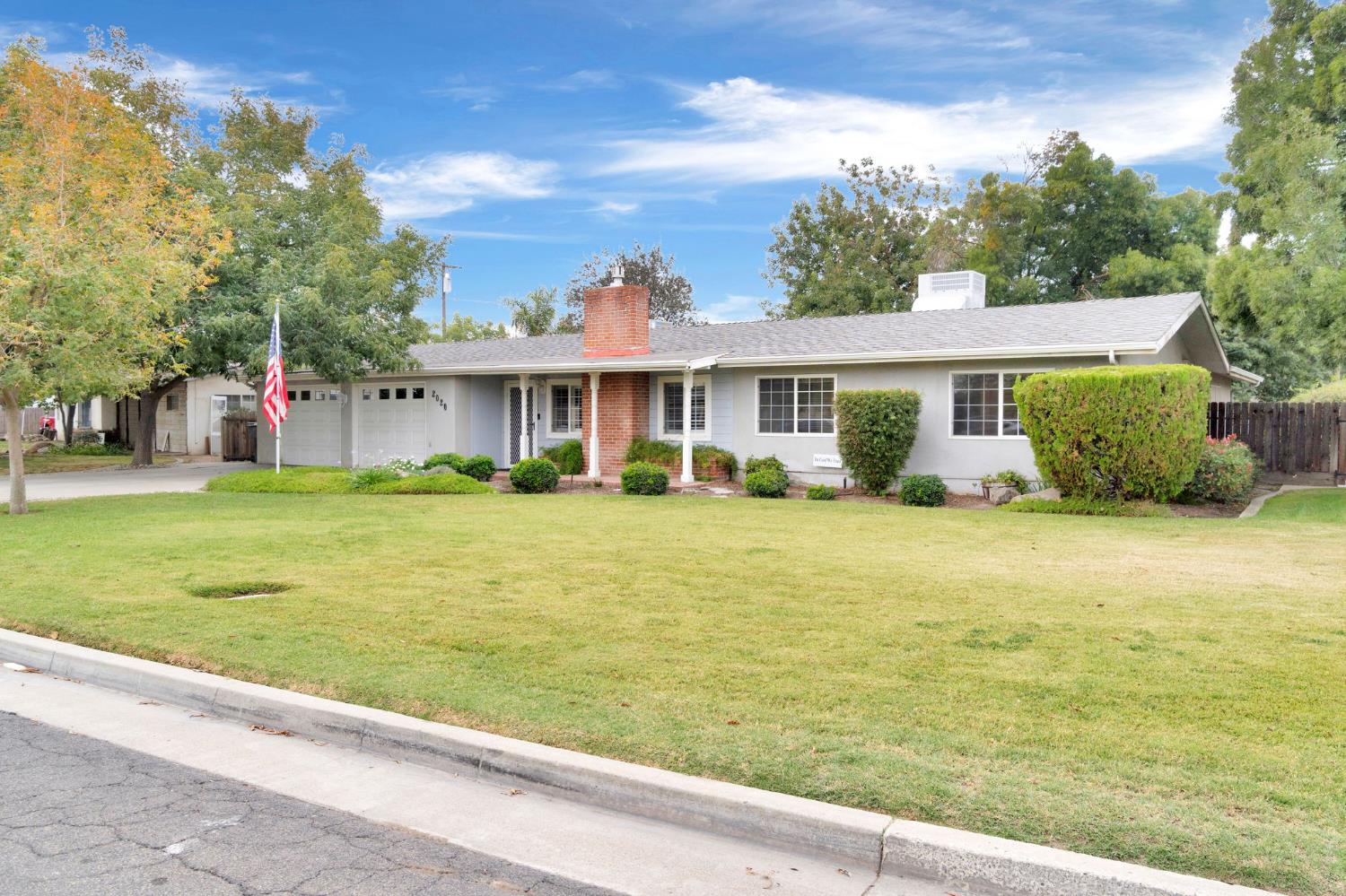 2020 Short Drive Hanford, CA 93230 - Photo 35 of 38 a front view of a house with garden