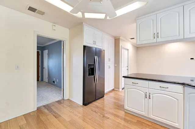 a view of a kitchen with electric appliances