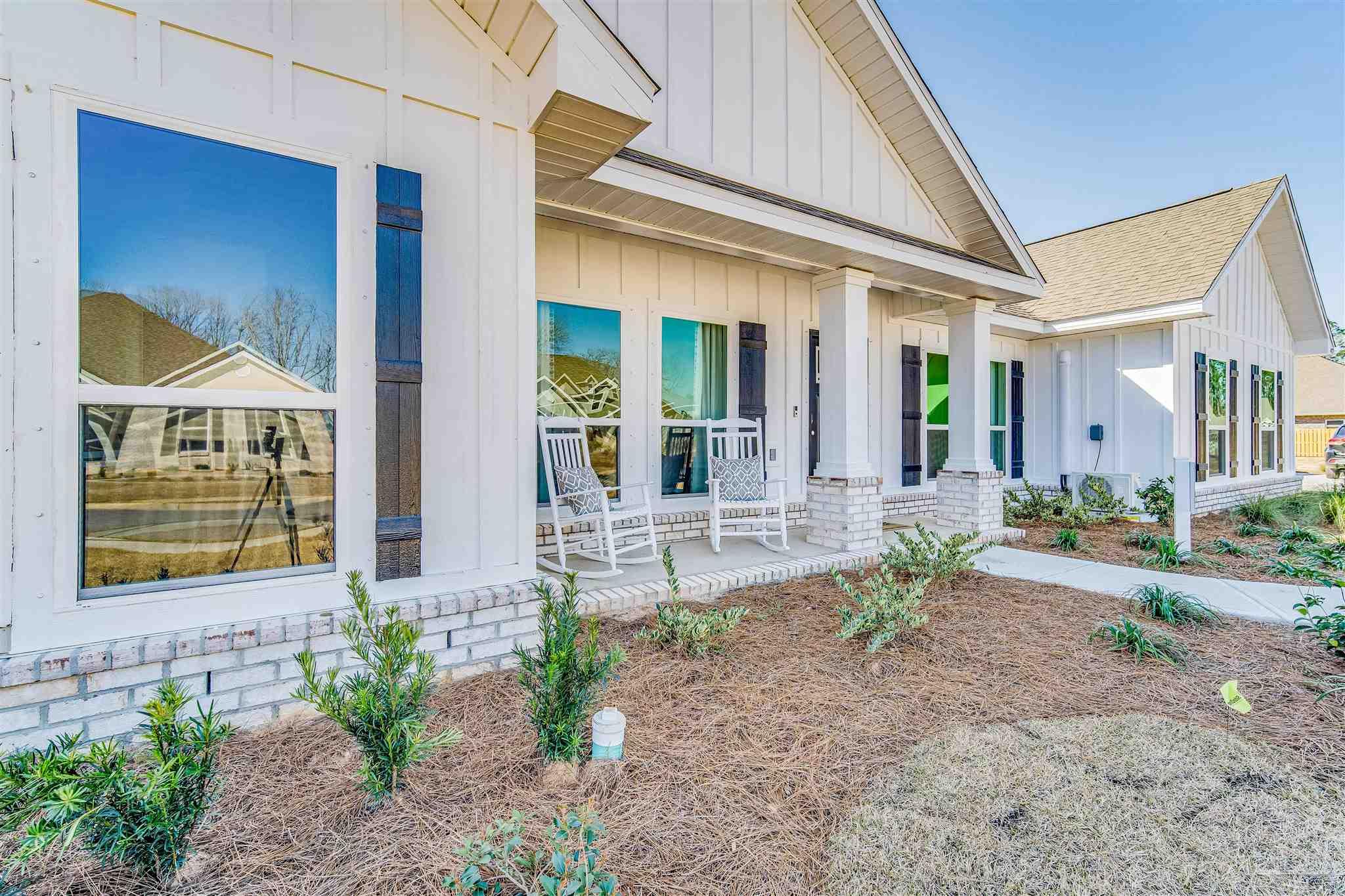 5780 Windham Road Milton, FL 32570 - Photo 2 of 37 a front view of a house with garden