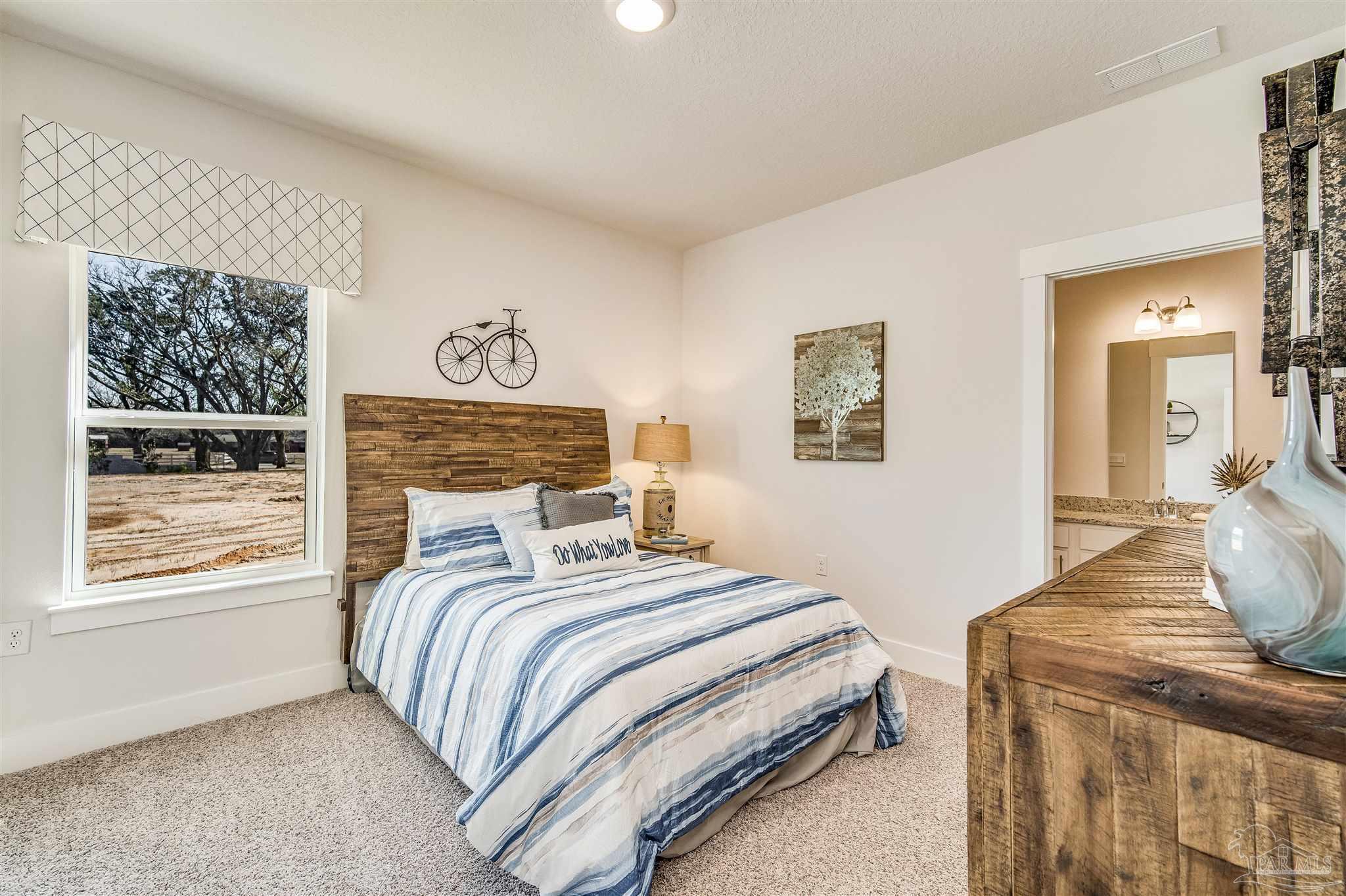 5780 Windham Road Milton, FL 32570 - Photo 21 of 37 a bedroom with a bed and window