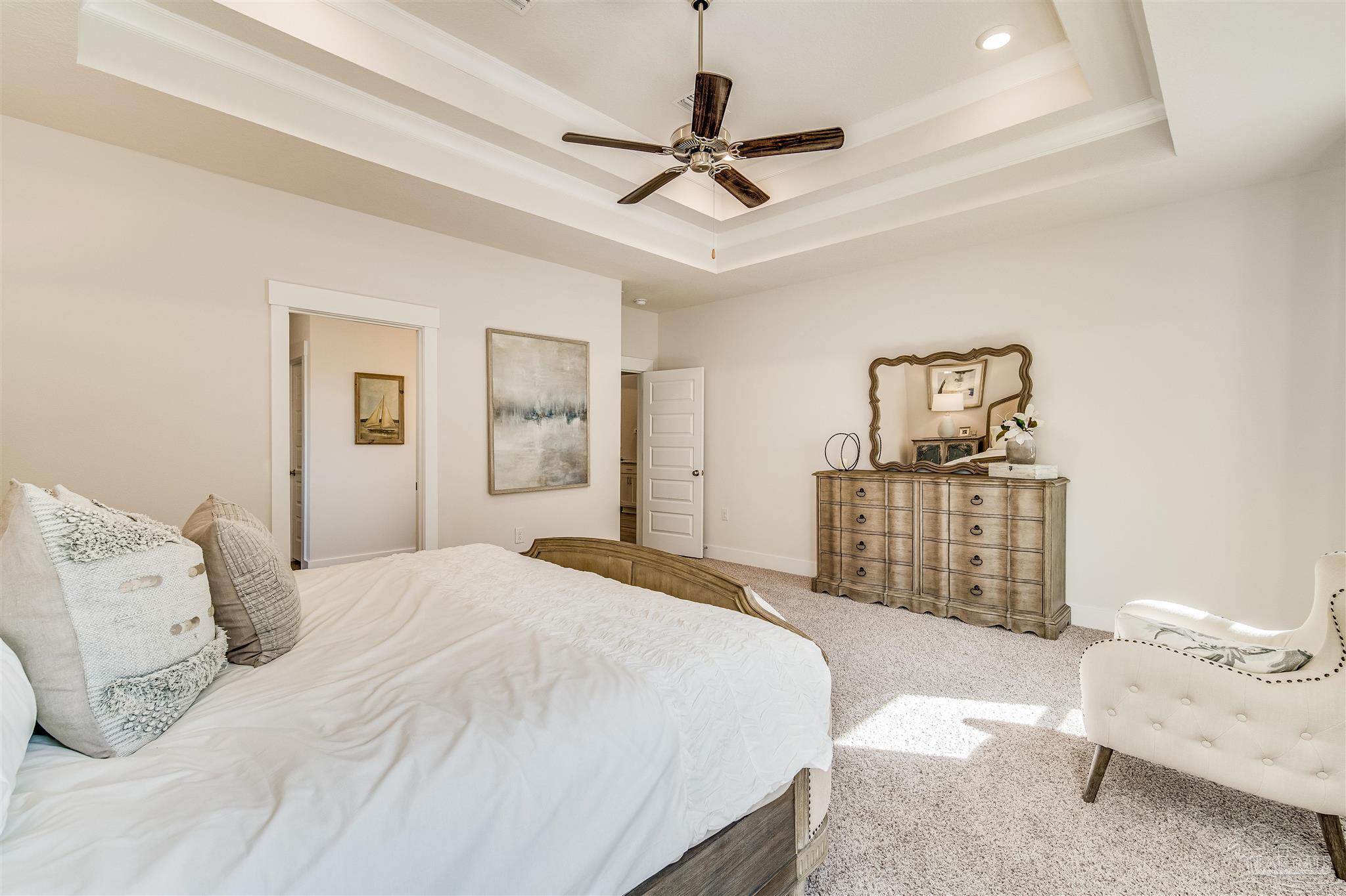 5780 Windham Road Milton, FL 32570 - Photo 31 of 37 a bedroom with a bed cabinets and a window