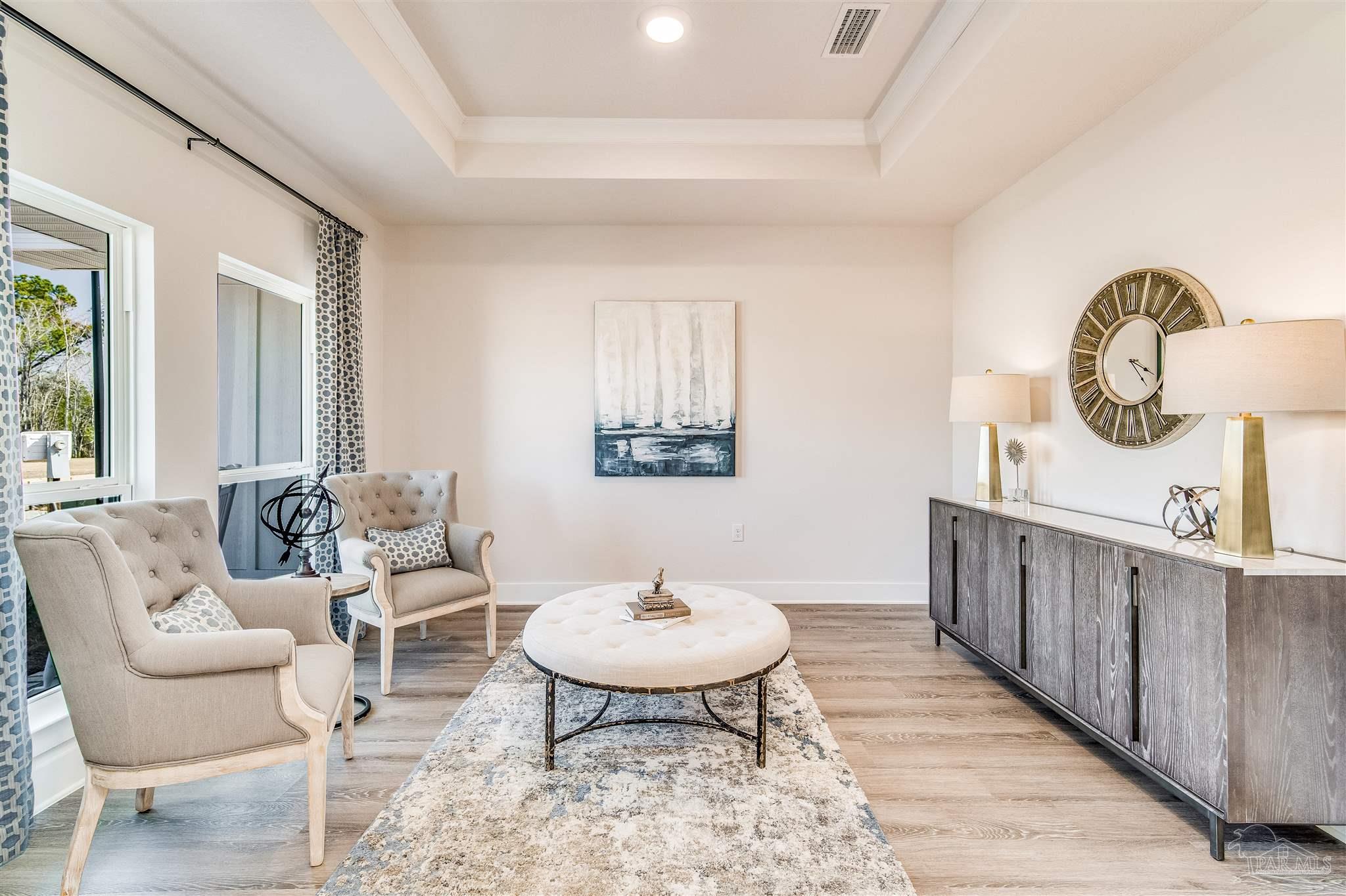 5780 Windham Road Milton, FL 32570 - Photo 8 of 37 a living room with furniture a window and a table