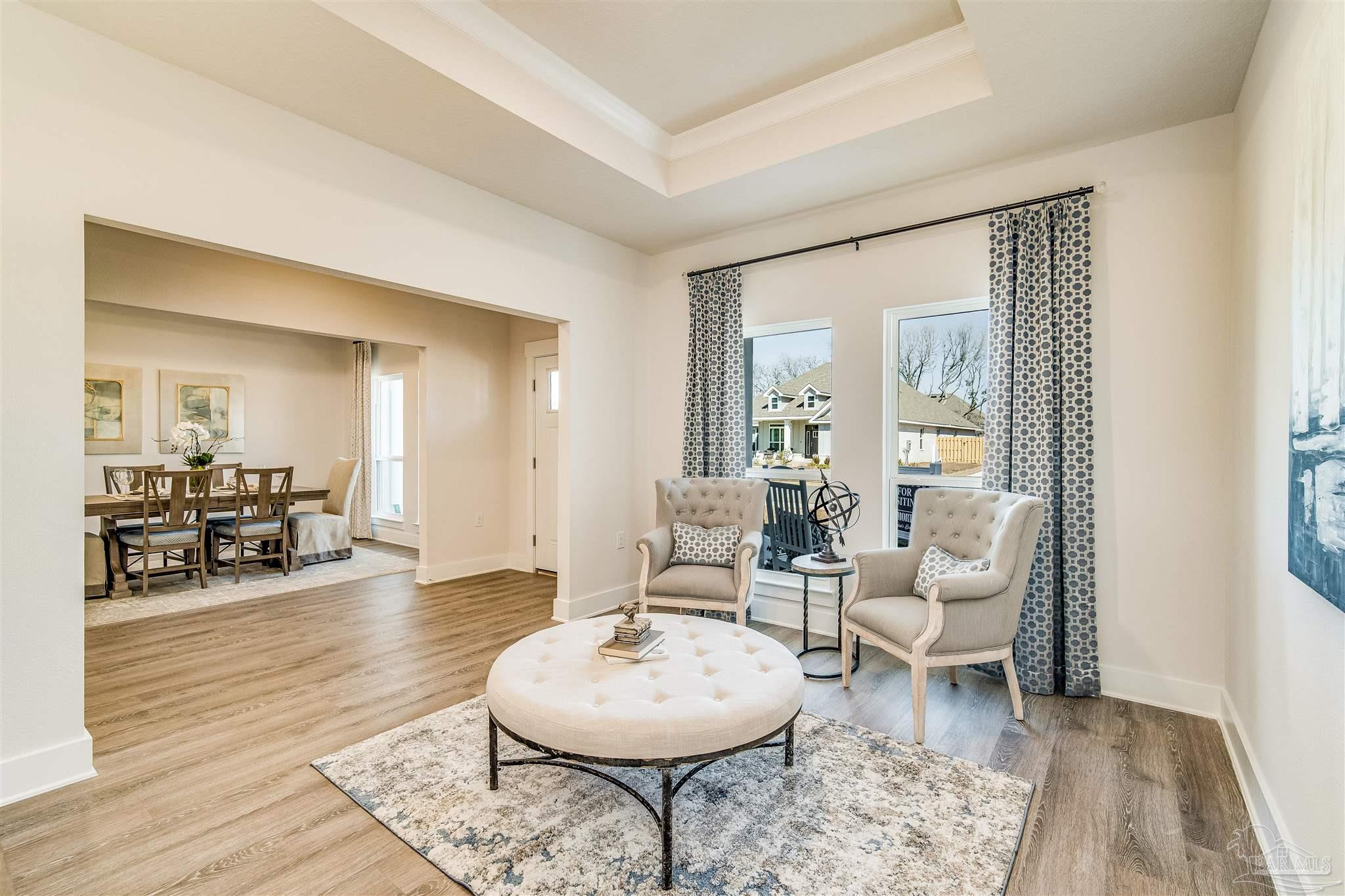 5780 Windham Road Milton, FL 32570 - Photo 10 of 37 a living room with furniture and a wooden floor