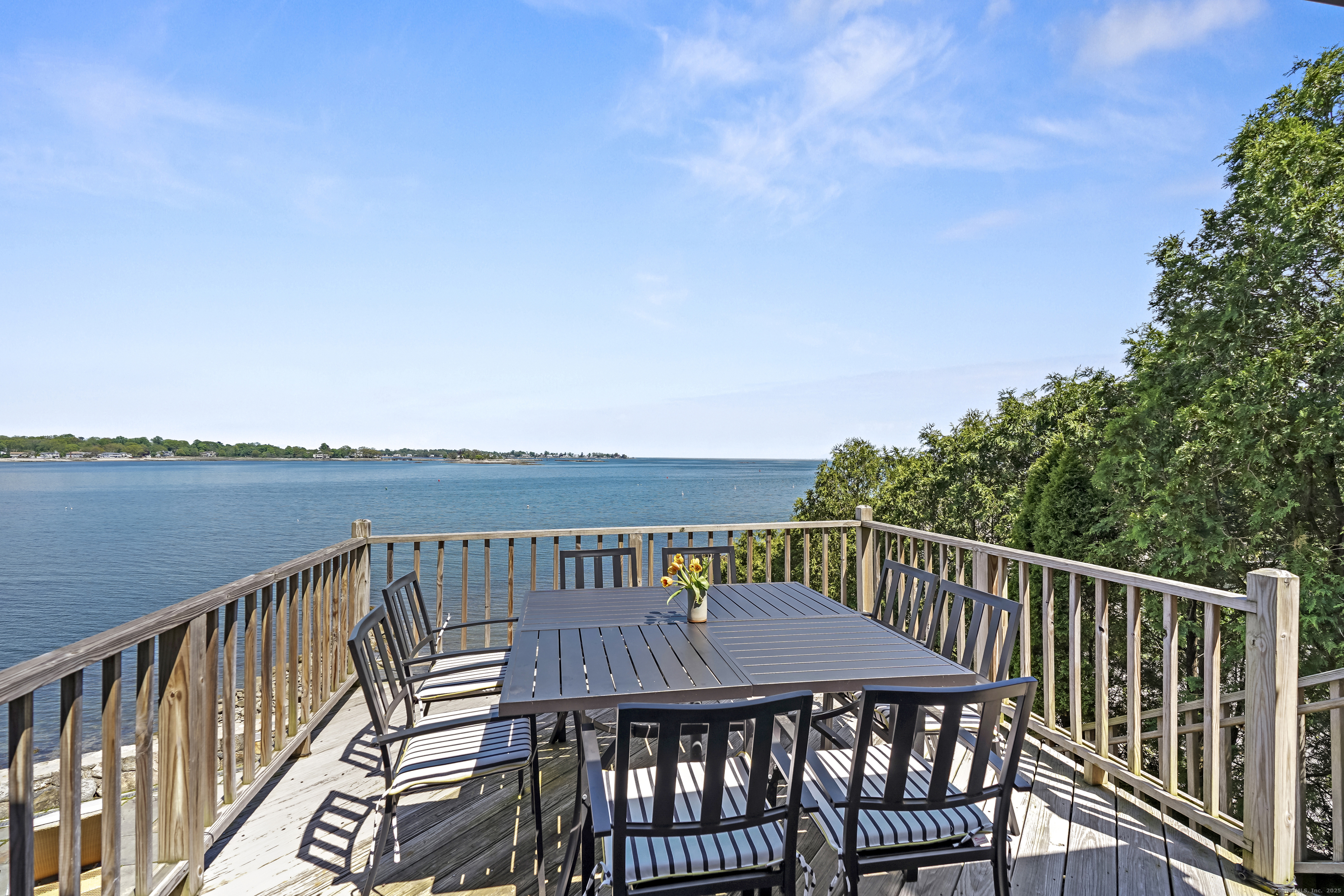64 Ocean Drive East Stamford, CT 06902 - Photo 11 of 38 a view of a deck with two chairs and a table