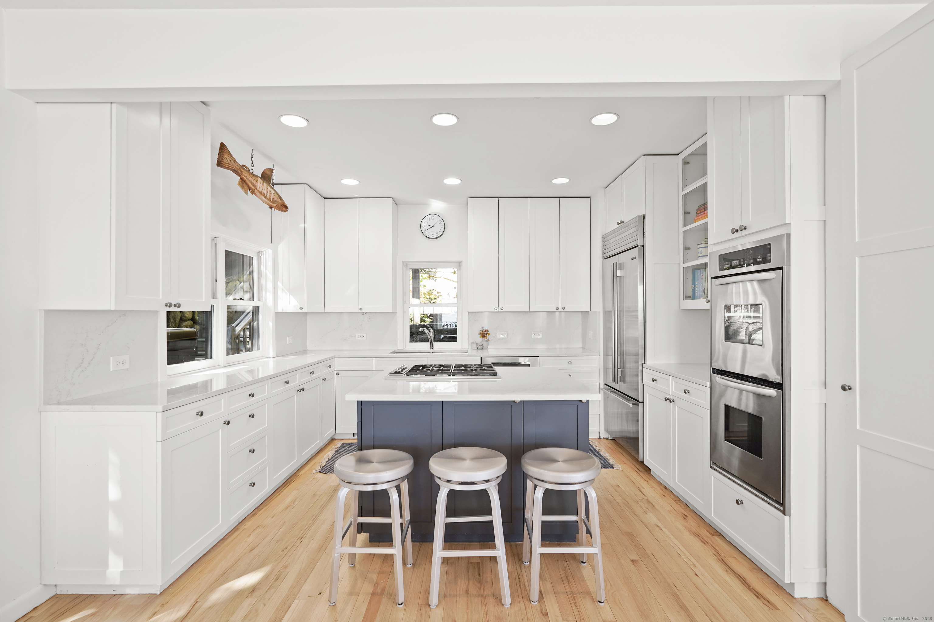 64 Ocean Drive East Stamford, CT 06902 - Photo 12 of 38 a kitchen with stainless steel appliances kitchen island granite countertop a sink and cabinets