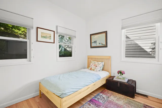 a bathroom with a sink mirror and toilet