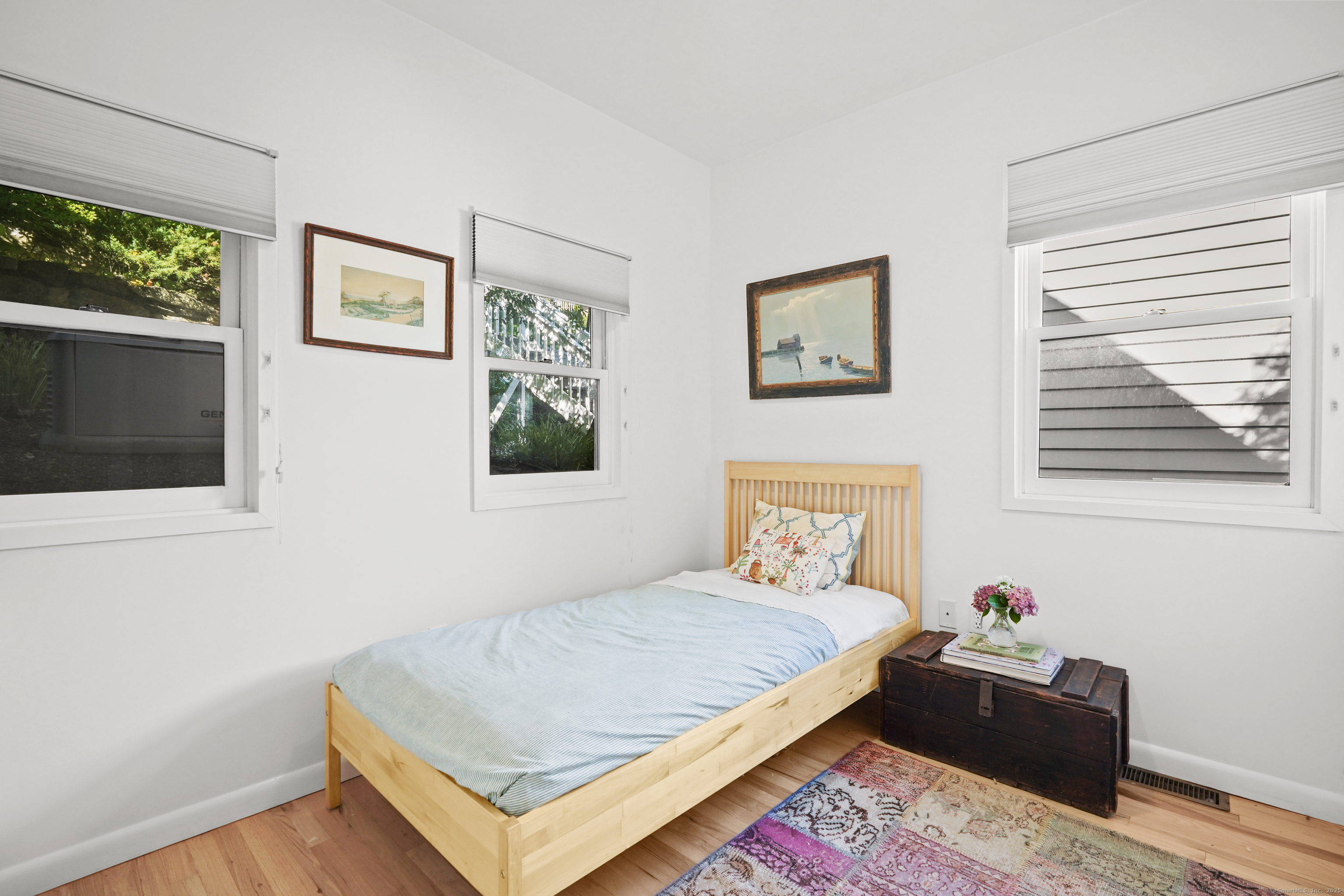 64 Ocean Drive East Stamford, CT 06902 - Photo 14 of 38 a bedroom with a bed and a window