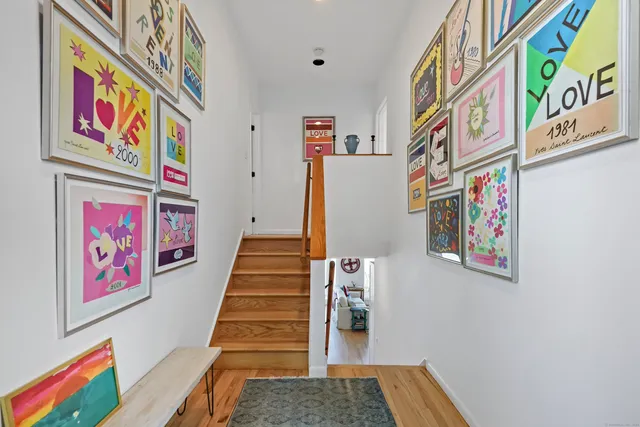 a bed room with a bed and large windows