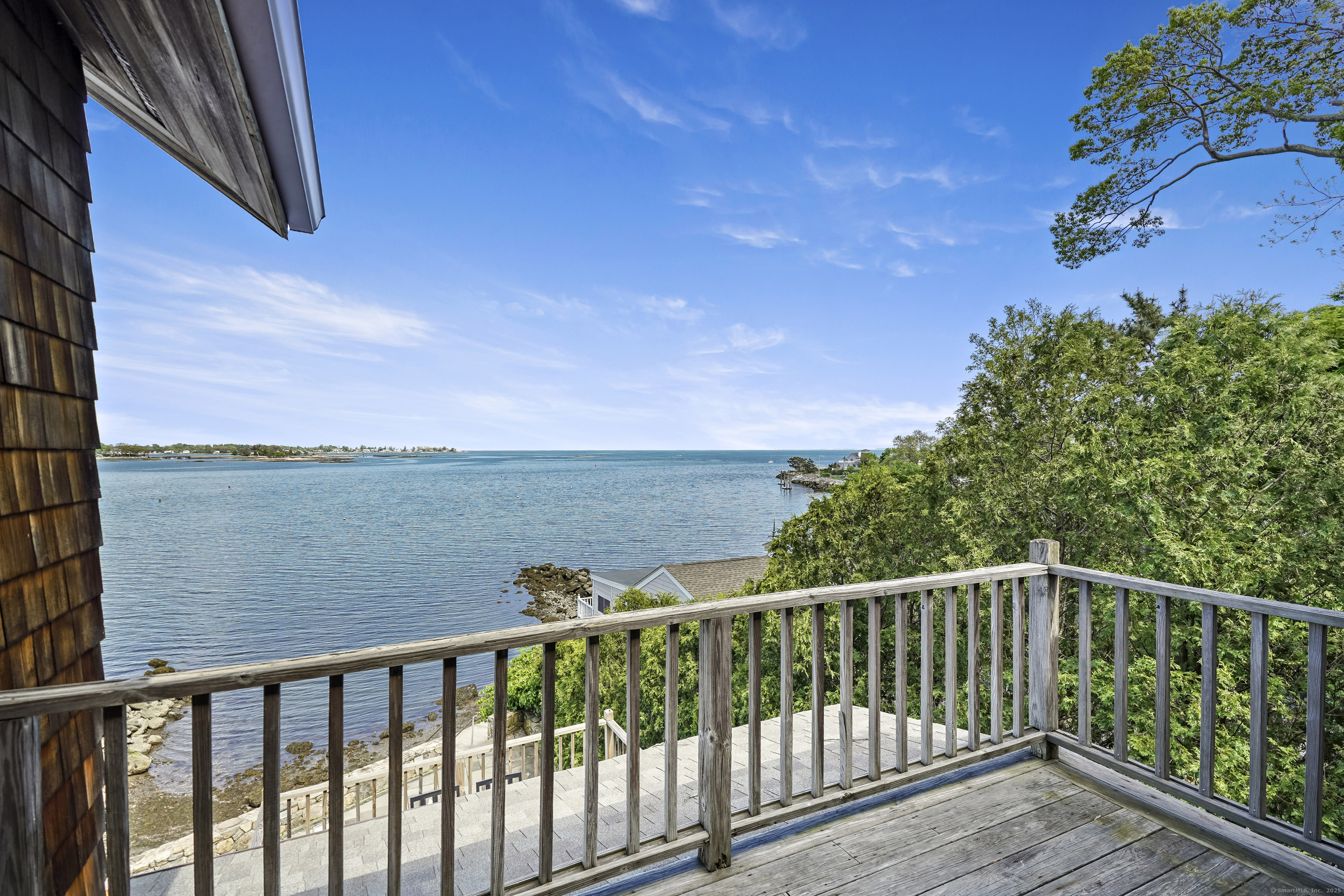 64 Ocean Drive East Stamford, CT 06902 - Photo 19 of 38 a view of a balcony with wooden floor and fence