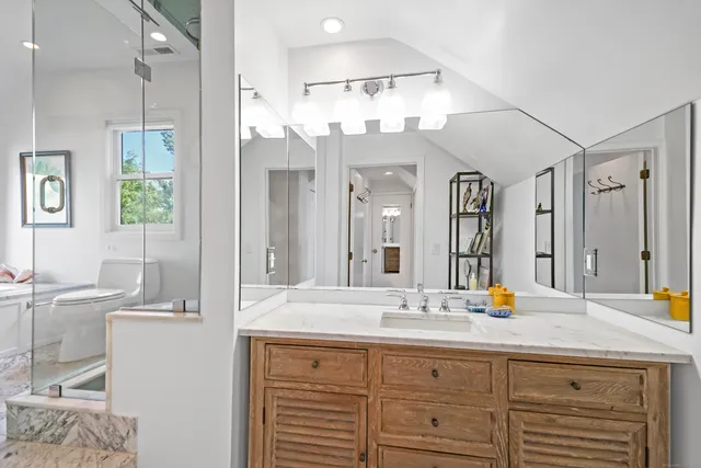 a bathroom with a bathtub and a shower